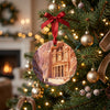 Petra Treasury holiday keepsake displayed hanging gracefully from a lit Christmas tree branch.