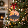 Ceramic Cambodia souvenir ornament hanging gracefully from an illuminated Christmas tree branch.
