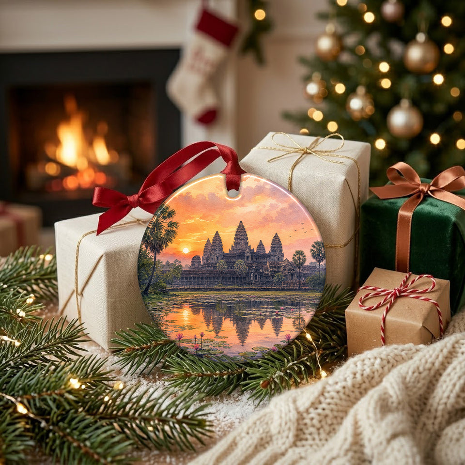 Holiday travel ornament arranged alongside wrapped seasonal gifts near a warm glowing fireplace.