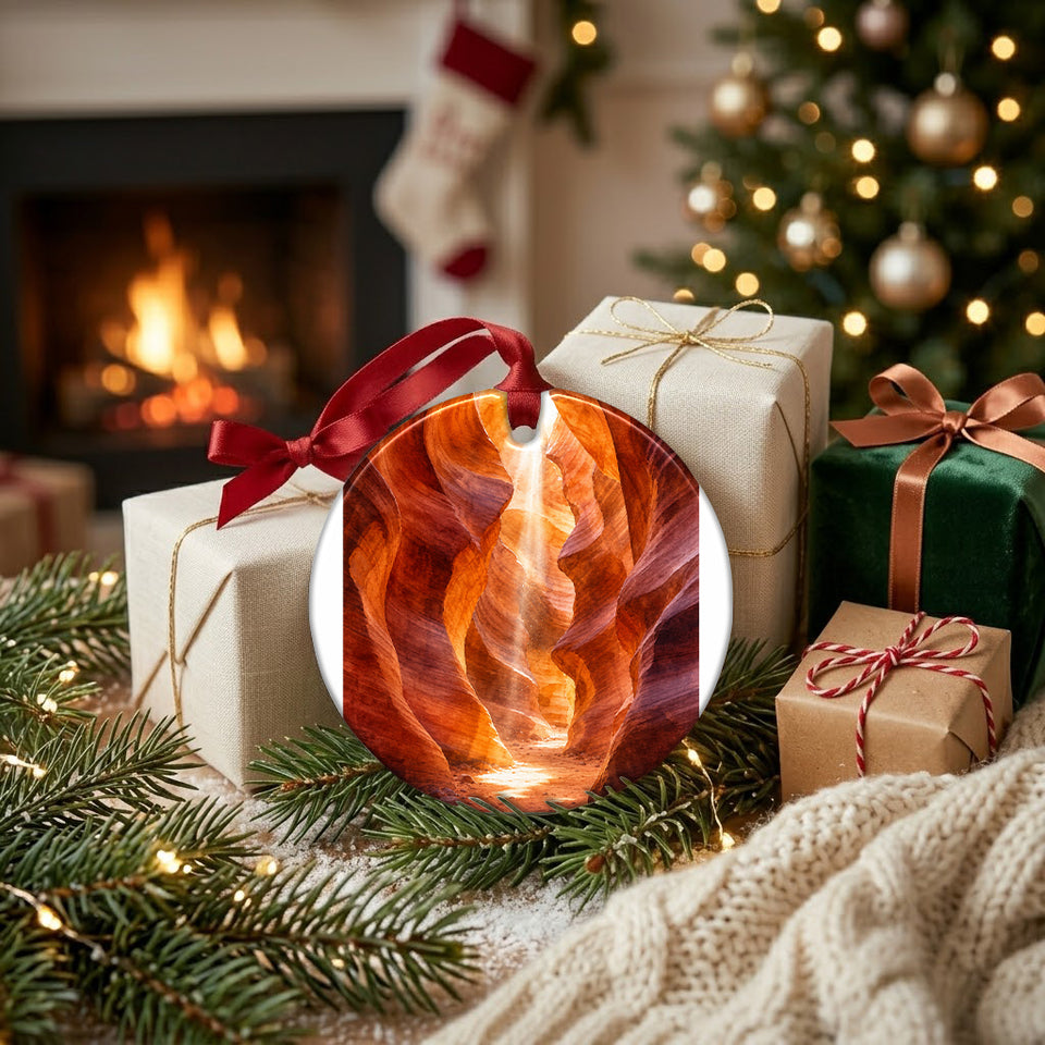 Festive holiday setup showing the round ceramic decoration resting beside wrapped gifts.