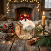 Rustic table display with natural pinecone accents and candle glow around the holiday ornament.