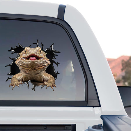 Humorous baby bearded dragon accessories sticker placed on the smooth surface of a toilet lid.