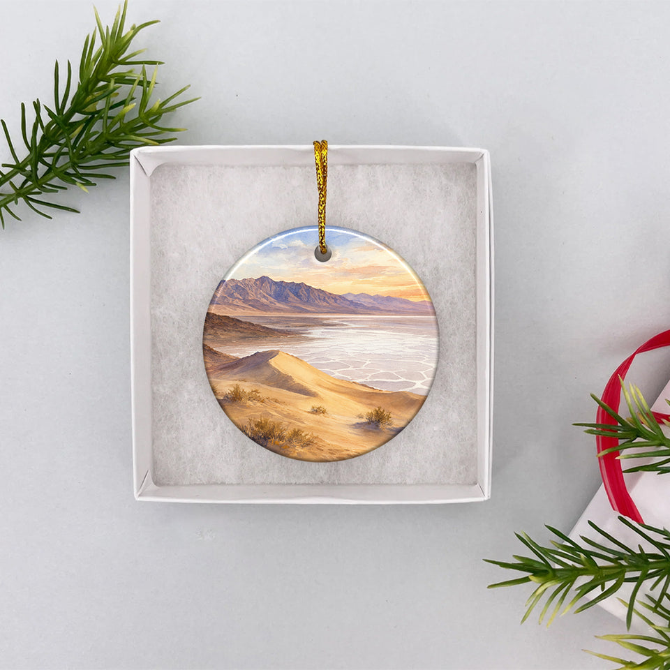 Ceramic holiday ornament resting inside an opened white gift box ready for Christmas giving.