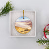 Ceramic Badwater Basin ornament nestled neatly inside an opened white gift box for travelers.