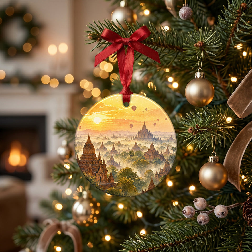 Ceramic holiday decoration hanging from an illuminated branch of a decorated Christmas tree.