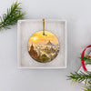 Travel keepsake nestled securely inside an open white gift box ready for holiday gifting.