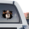 Glossy Basset Hound decal decorating the rear glass of a truck outdoors.