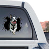 Glossy dog art sticker placed cleanly on the rear window of a truck outdoors.
