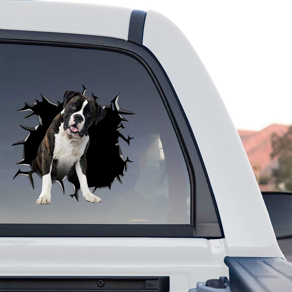 Adhesive Boxer Dog window decal displayed on the rear window of a truck outdoors.
