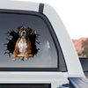Detailed Boxer face decal clearly displayed on the rear window of a truck parked outdoors.
