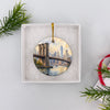 Holiday travel keepsake presented inside an open white gift box ready for gifting.