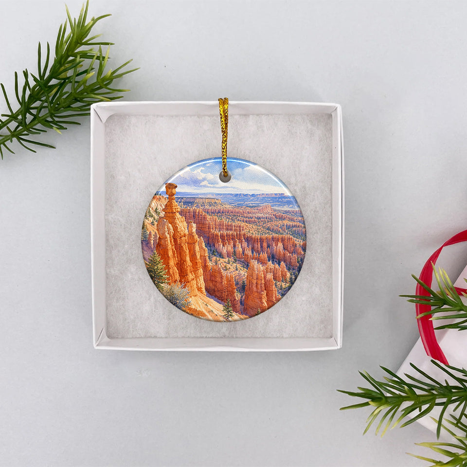 Scenic Utah rock formation ornament resting neatly inside an open white gift box.