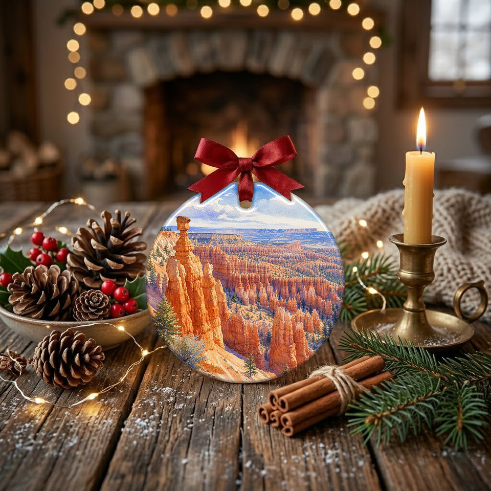 Detailed canyon landscape ornament styled on a rustic tabletop with a pinecone and candle.