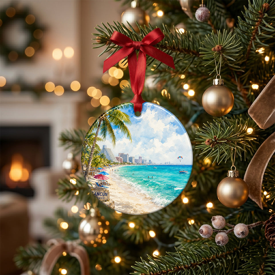 Holiday tree branch decorated with a ceramic ornament depicting the sunny Cancún coastline.