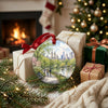 Central Park travel keepsake resting beside festive wrapped gifts near a cozy glowing holiday fireplace.