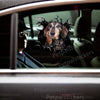 Cute Dachshund vinyl decal applied smoothly onto the side car door of a white sedan.