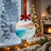 Desert landscape ornament catching morning light while suspended near a frosty winter window.