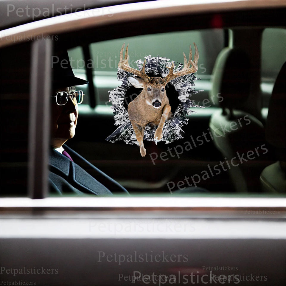 Clear outdoor deer sticker cleanly applied to a black car door exterior.