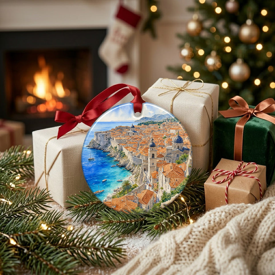 Croatia travel ornament resting beside holiday gifts and the warm glow of a cozy brick fireplace.