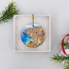Packaged Dubrovnik holiday keepsake resting open inside an elegant white gift box ready for holiday gifting.