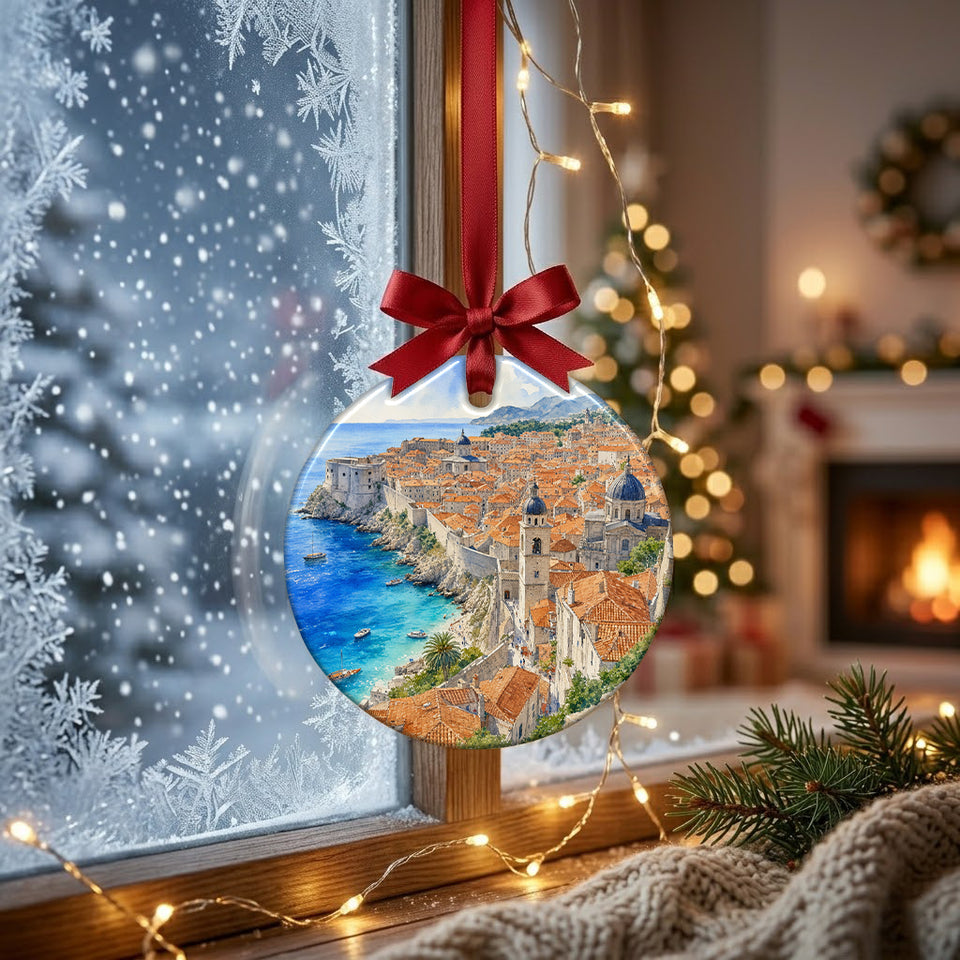 Ceramic Dubrovnik souvenir hanging by a frosty winter window with soft natural daylight shining through.