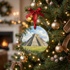 Yucatán Mayan pyramid holiday keepsake hanging on a glowing Christmas tree branch.