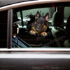 Vibrant German Shepherd vinyl sticker styled cleanly across a black car door exterior.