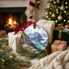 Ceramic mountain keepsake arranged near festive holiday gifts in a warm living room.