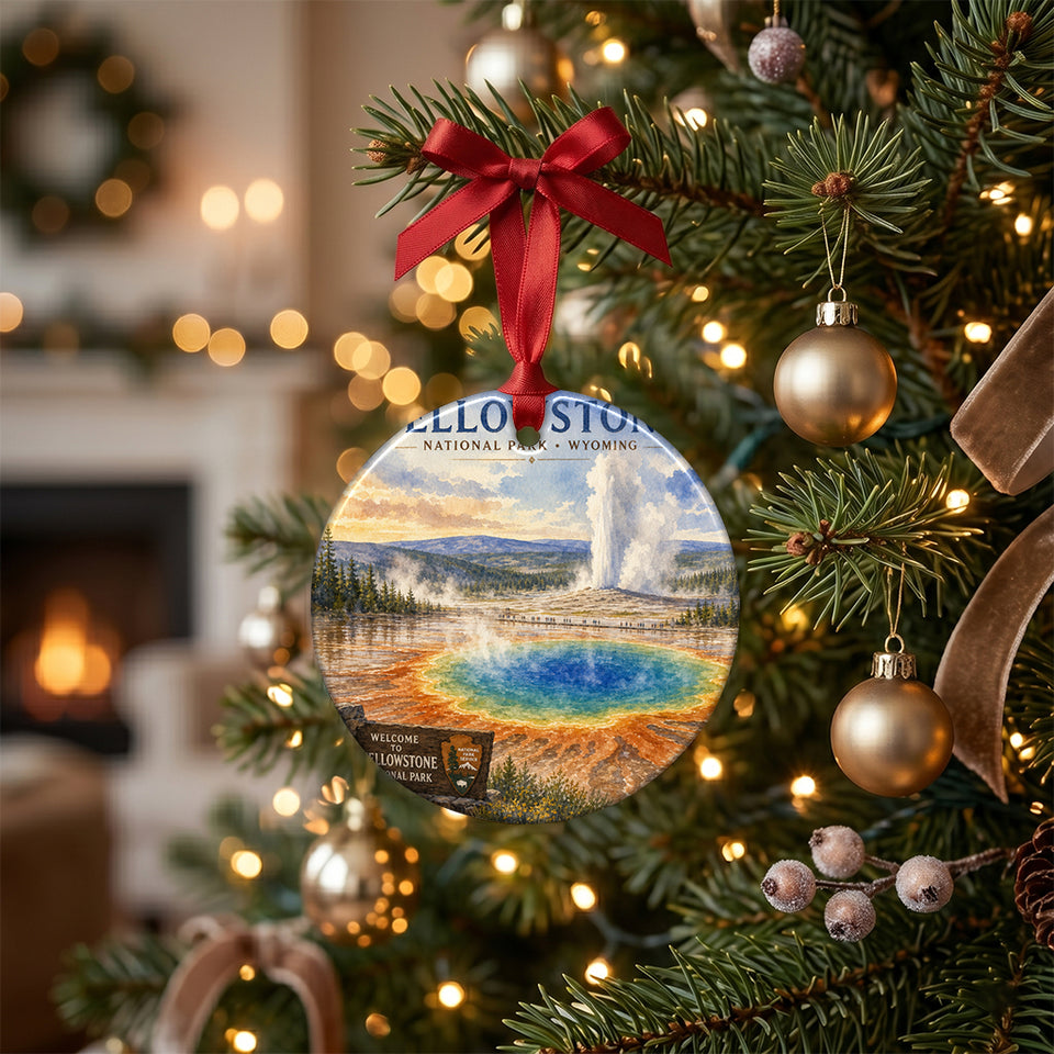 Yellowstone holiday ornament hanging gracefully from a pine branch on an illuminated Christmas tree.