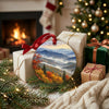 Ceramic Smoky Mountains keepsake placed beside wrapped holiday gifts near a glowing hearth.