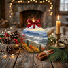 Appalachian ridge keepsake displayed on a rustic table beside pinecones and candlelight.