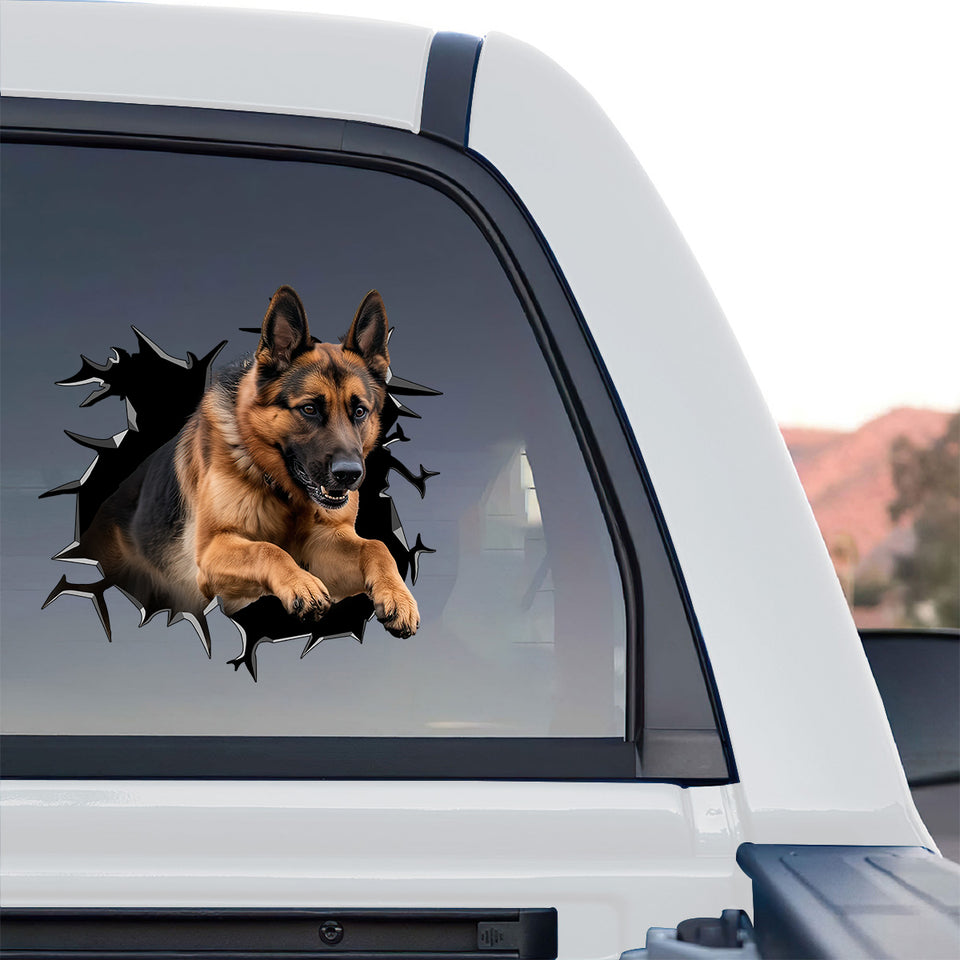 Detailed Gsd dog decal proudly displayed on the rear window of a truck outdoors.