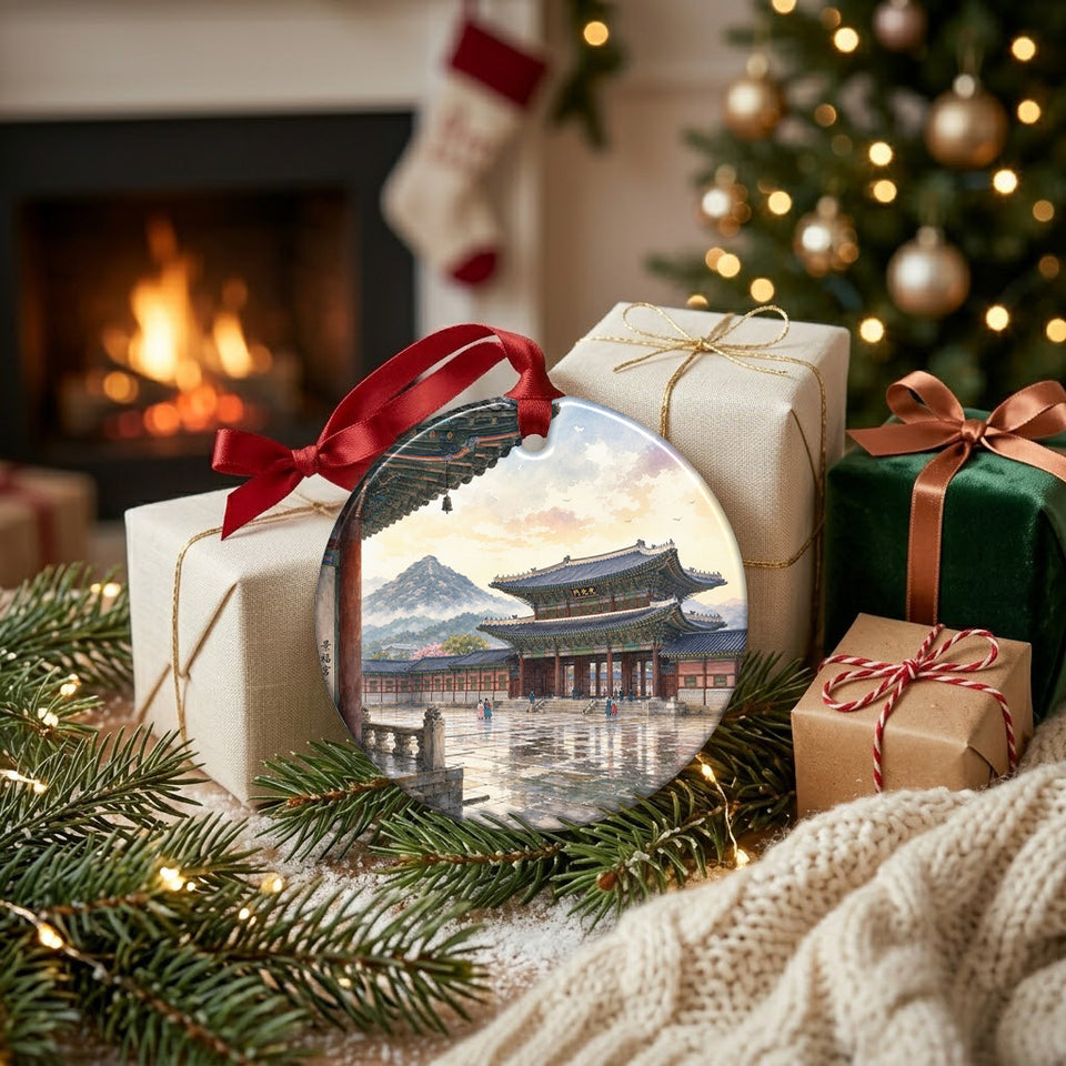 Ceramic Gwanghwamun Gate keepsake placed alongside festive wrapped gifts near a warm fireplace.