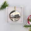 Gyeongbokgung palace souvenir ornament nestled securely inside an open white gift box ready for giving.