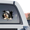 Waterproof dog sticker adhered smoothly to the rear window of a truck.