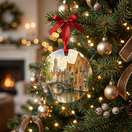 Round ceramic Bruges keepsake showcased on a rustic table alongside a glowing candle and pinecone accents.