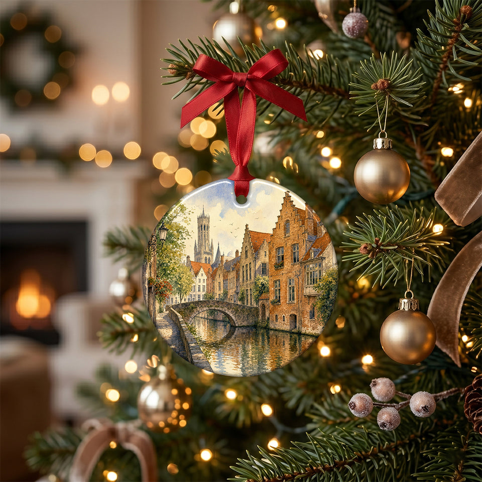 Holiday decoration featuring Bruges canal artwork hanging gracefully from an illuminated Christmas tree branch.