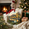 Festive holiday travel keepsake displayed beside wrapped gifts near a glowing fireplace.