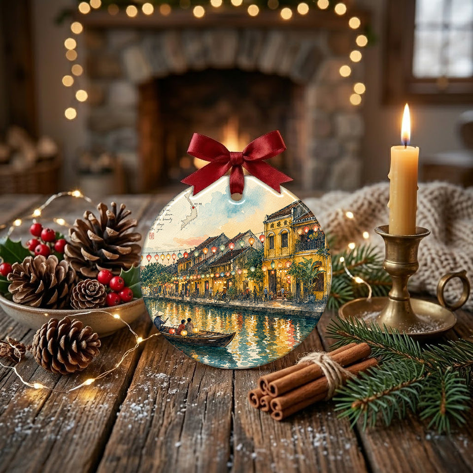Round travel keepsake styled on a rustic table next to seasonal pinecones and a candle.