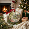 Festive Savannah ceramic ornament arranged neatly beside wrapped holiday gifts near a warm glowing fireplace.