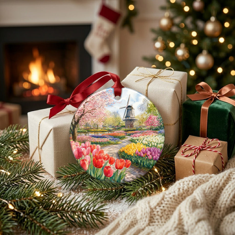 Round ceramic Netherlands ornament arranged beside wrapped holiday gifts near a glowing fireplace.