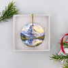 Matterhorn holiday ornament nestled neatly inside an open white gift box ready for festive gifting.