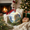 Ceramic travel keepsake styled next to wrapped holiday gifts beside a warm, glowing fireplace.