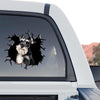 Gloss laminated Schnauzer face decal displayed prominently on the rear glass of a truck.