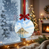 Festive tidal abbey decoration suspended in front of a frosty winter window in daylight.