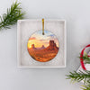 Monument Valley holiday keepsake resting securely inside an open white gift box ready for Christmas gifting.