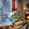 Hawaii travel ornament catching natural light as it hangs in front of a frosty window.