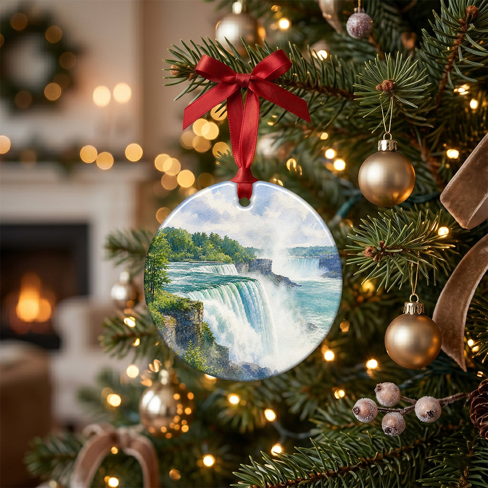 Festive Niagara Falls keepsake hanging delicately from an evergreen branch on a lit Christmas tree.