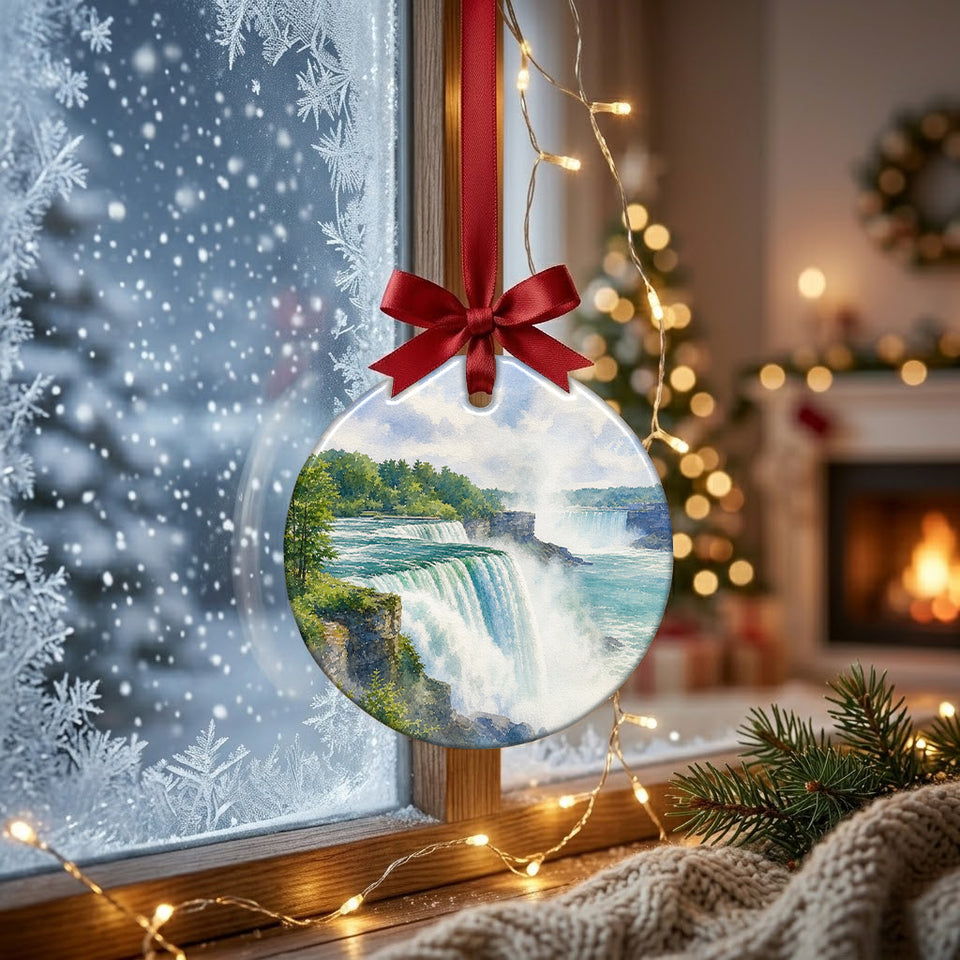 Sunlight streaming through a winter window illuminating the scenic Niagara Falls ceramic ornament.