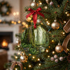 Lush Olympic National Park holiday keepsake hanging from a warm, illuminated Christmas tree branch.